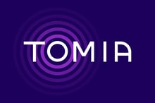 Tomia_Logo_MagentaWhiteTextOnDeepPlum